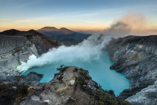 Famous Ijen volcano crater and acidic lake at sunrise in East Java - Powered by Adobe
