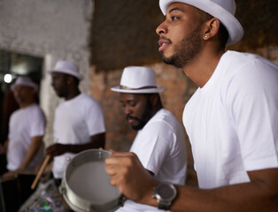 Man, percussion and night with band playing music for performance, concert or musical event. Male person or group of musicians playing instruments in late evening for sound or fun local entertainment