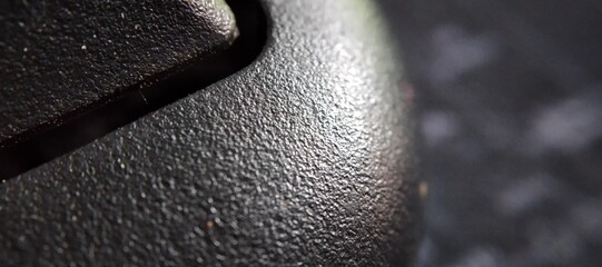 Macro shot of a black computer mouse, shallow depth of field