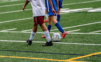 soccer player kicking the ball