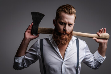 Beard styling. Brutal Caucasian hipster with moustache. Bearded man isolated on grey. Bearded man...