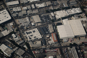 Aerial view of Vernon, an industrial city near Downtown Los Angeles. Rooftops of warehouses,...