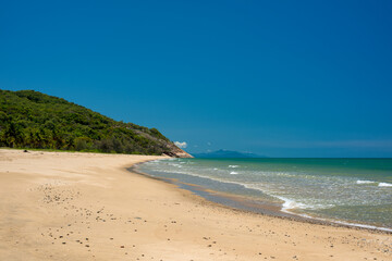 Sink your toes into the golden sands of Wangetti Beach, Far North Queensland, where crystal-clear waters meet pristine coastline.