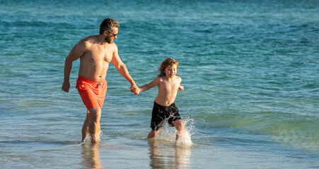 Father son bonding enjoying summer vacation. Special moments between dad and son at sea. Father son adventures. dad and son running in sea beach. Quality time with dad and kid