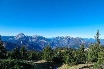 Fototapeta na wymiar Panoramic view of majestic mountain peaks of Gesäuse seen from Hochblaser in Eisenerz Alps, Ennstal Alps, Styria, Austria. Idyllic hiking trail in remote Austrian Alps in summer. Wanderlust in nature