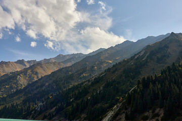 view of the top of the mountains and the sky with clouds