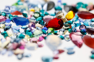 A group of beautiful gemstones on a white background with a blurred background and bokeh.