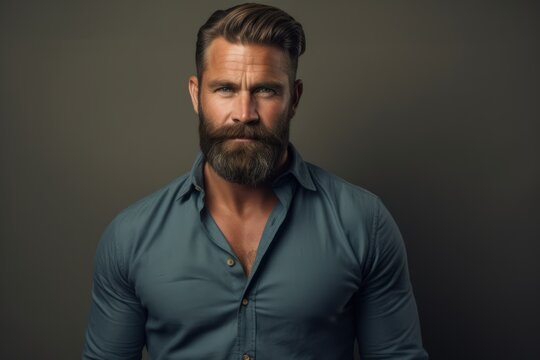 Handsome bearded man in blue shirt. Men's beauty, fashion.
