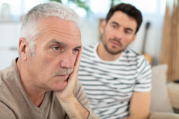 stressed angry senior man trying to talk to dad