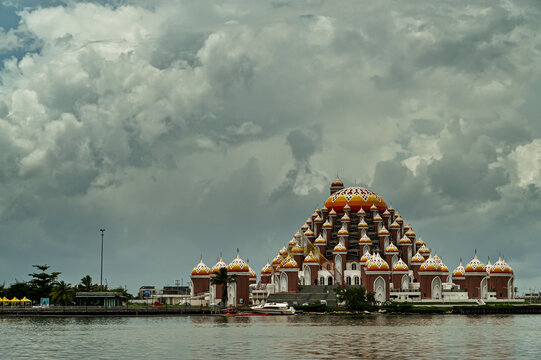Mosque 99 dome or Mesjid kubah 99 or Mesjid Asmaul Husna in Makassar, Sulawesi Selatan, Indonesia, with cloudy sky in sunny day