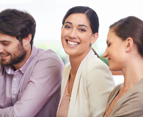 Fototapeta premium Portrait, smile and woman with creative team in office for design, meeting or planning together. Face, business and collaboration with happy young designer group in workplace boardroom for teamwork