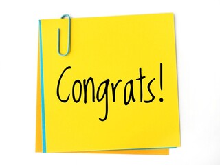 Congrats! handwritting message on a yellow sticky note