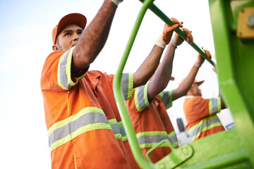 Industry, waste management and garbage truck with men in uniform cleaning outdoor on city street. Job, service and male people working with rubbish for sanitation, maintenance or collection of dirt.