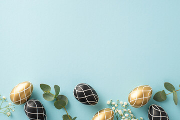 Holy Easter design: Top view of lavish black and gold eggs nestled among eucalyptus leaves and gypsophila flowers, arrayed on a pastel blue surface, with a clear area for text or advertising