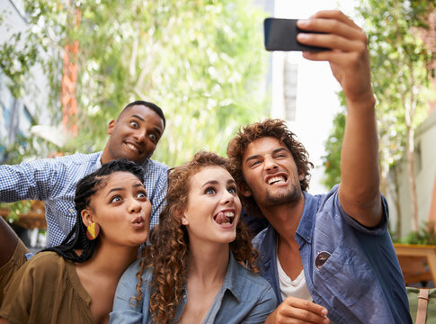 Funny, face and group of friends for selfie at university campus for profile picture update or social media post. Men, women and happy students with technology for memory, diversity and college fun