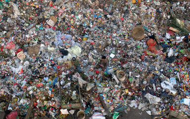 Cleaning workers are working on the piles of garbage with health risks.