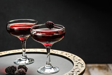 cocktail with juice decorated with blackberries