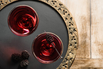 cocktail with juice decorated with blackberries