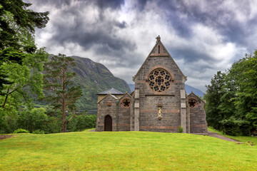 The catholic church of St Mary and St Finnan, on the banks of Loch Shiel, Glenfinnan, Scotland. Consecrated in 1873. - 743549410