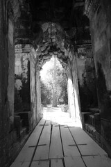 A light shone at the wide door in Angkor Wat temple. - obrazy, fototapety, plakaty