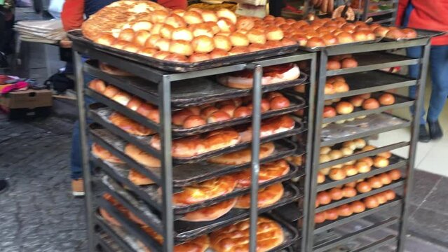 Racks of freshly baked breads cooling