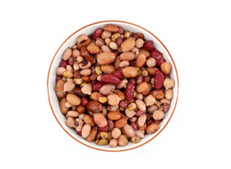Mix of boiled legumes in a ceramic bowl. Legumes are chickpeas, different varieties of beans and...