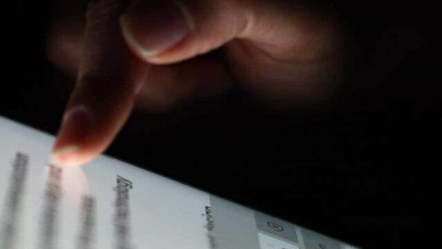 Background of extremely close-up  human fingers scrolling touching the tablet screen. Social media communication.