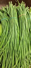 Green long beans bunched. Chinese Long Beans or kacang panjang. Ready sold in traditional market