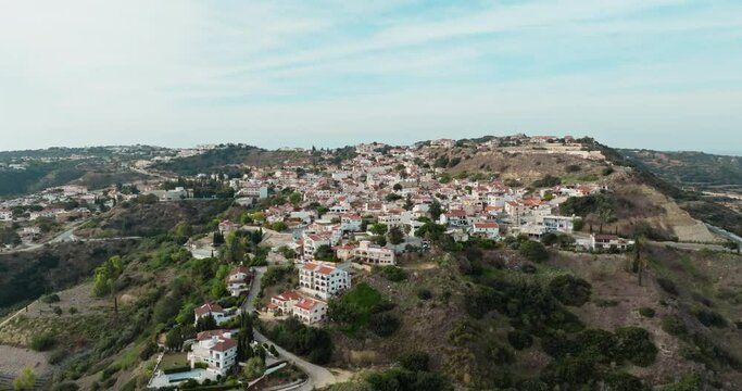Aerial view Pissouri village Cyprus. The landscape of the mountains in which the village is located. architecture of historical buildings. High quality 4k footage
