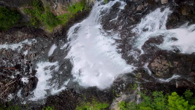 Majestic Waterfall Top View of Water Cascading Over Cliffs