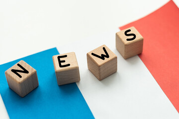 concept news feeds - Breaking news, French country's flag, blackboard and the text Latest News on...
