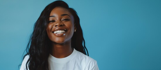 young black lady with white shirt on isolated blue background