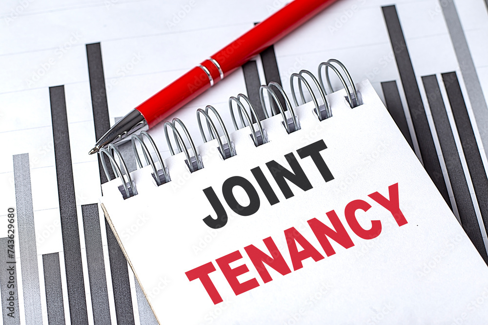 Aufkleber joint tenancy text written on notebook with pen on chart