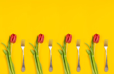 Holiday card. Food delivery. Dinner time. Red tulips with fork on yellow background. Invitation on woman day March 8th. Banner copy space. Cleaning service certificate. Clean kitchen. Testy desert - obrazy, fototapety, plakaty