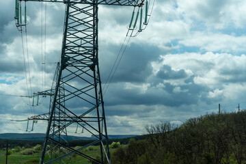 High voltage towers with sky background. Power line support with wires for electricity...