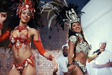 Portrait, carnival or women in costume dancing for celebration, music culture or samba in Brazil....