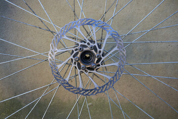 a disassembled wheel with a bicycle brake disc, close up front hubless bicycle wheel with disc...