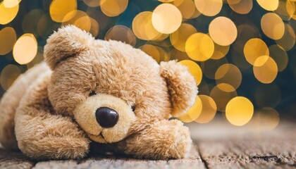 cute sleepy teddy bear with sparkling bokeh background