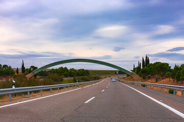 Naklejka premium on the highway in Spain. Greenwich meridian is ahead