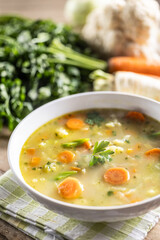 Spring vegetable soup with chopped and grated root vegetables, seasoned with yeast. Healthy vegetable vegetarian food - 743646451