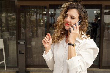 young entrepreneur woman doing business on the phone - Powered by Adobe