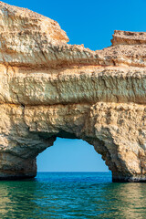 Bandar Al Jissah Arch, tourist attraction in Oman, Large hole, door in rock cliff
