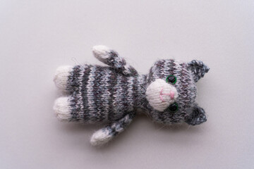 Knitted toy cat on a white background - 743656820