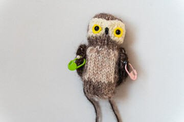 Knitted owl toy on a white background - 743656865