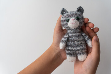 Knitted toy cat on a white background - 743656873