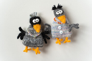 Knitted crow toys on a white background - 743657265