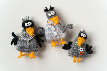 Knitted crow toys on a white background - 743657280