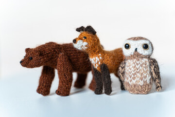 Knitted toys bear, fox, owls on a white background - 743657298