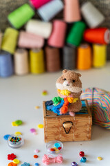 Knitted hamster toy with yarn and knitting accessories - 743658059