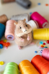 Knitted hamster toy with yarn and knitting accessories - 743658252